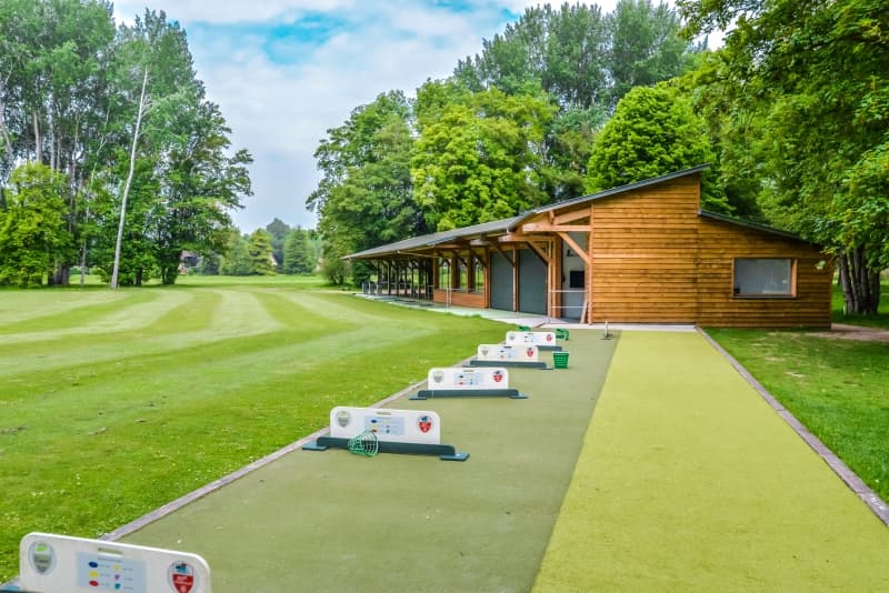 Covered practice range and hitting bays at Golf PGA France du Vaudreuil