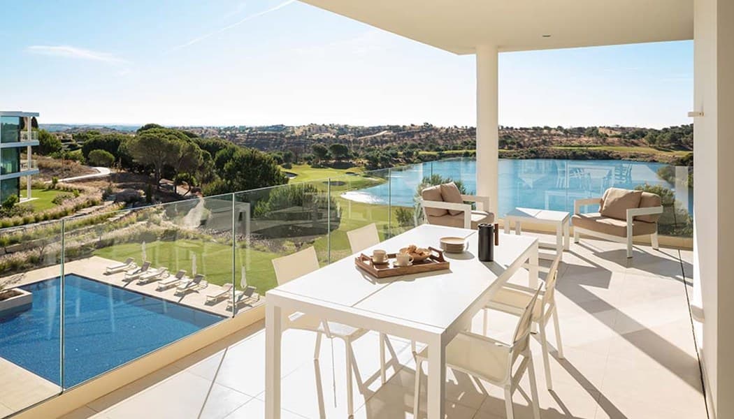 Clubhouse Residences terrace overlooking the swimming pool and golf course