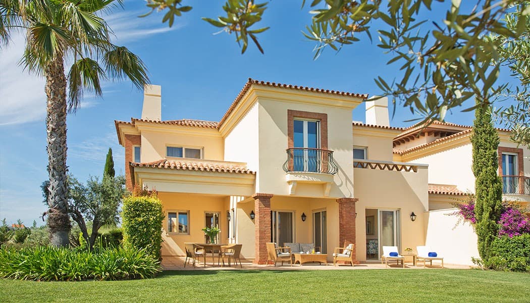 Monte Rei villa exterior with a garden and furnished terrace