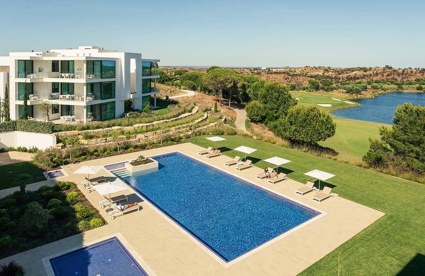 Clubhouse Residences and swimming pool overlooking Monte Rei’s golf course