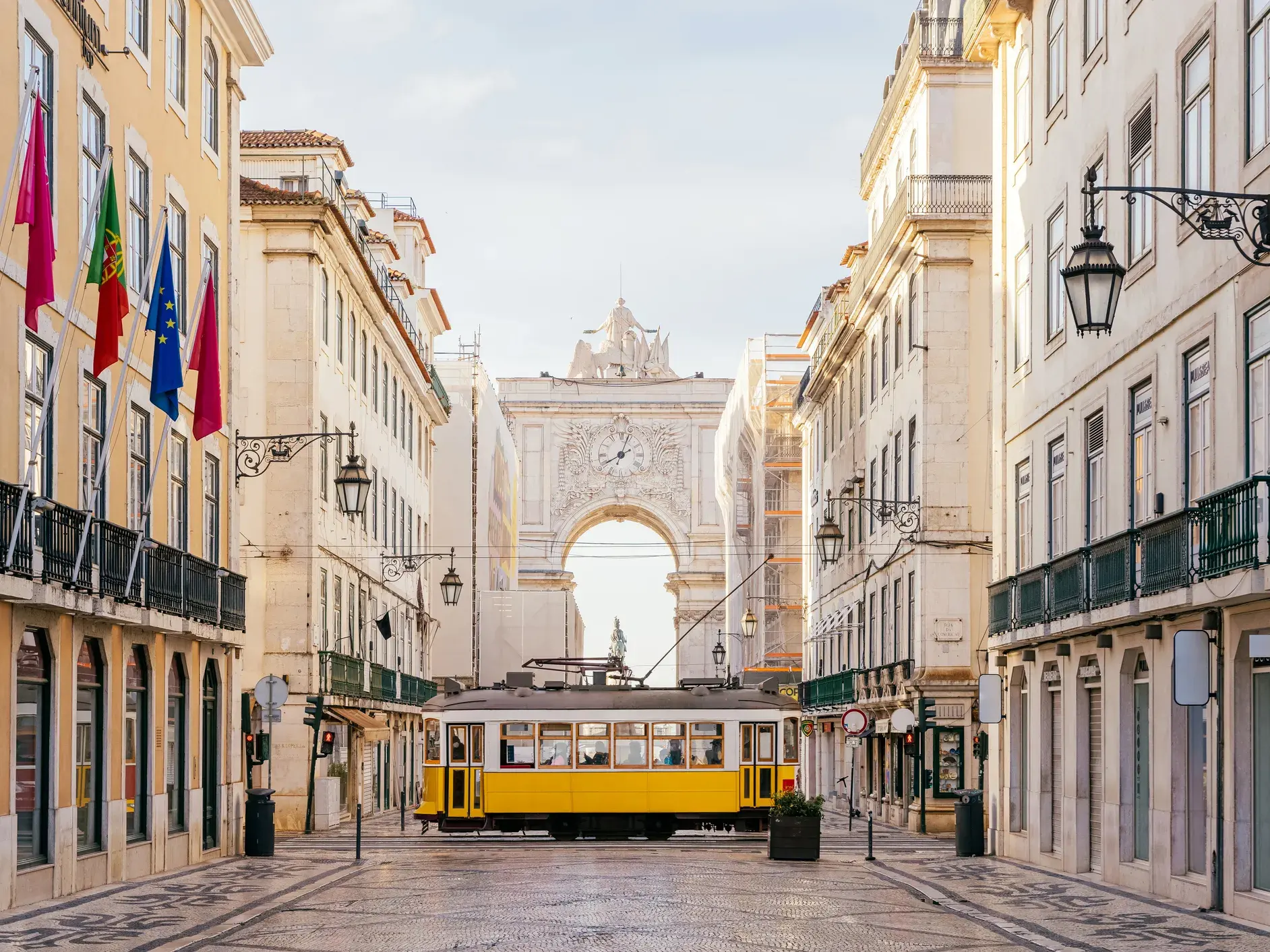 Yellow tram on a street in central Lisbon