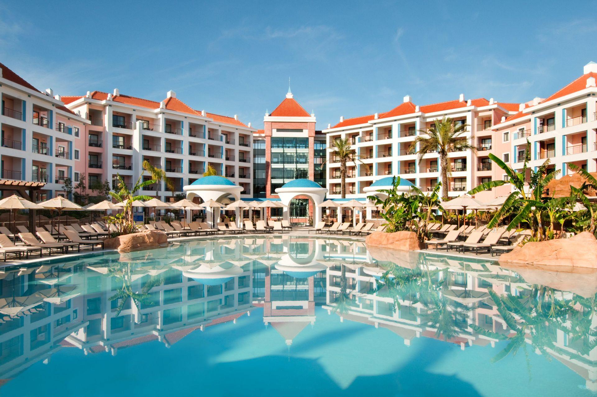 Pool and arcaded pavilions at Hilton Vilamoura As Cascatas